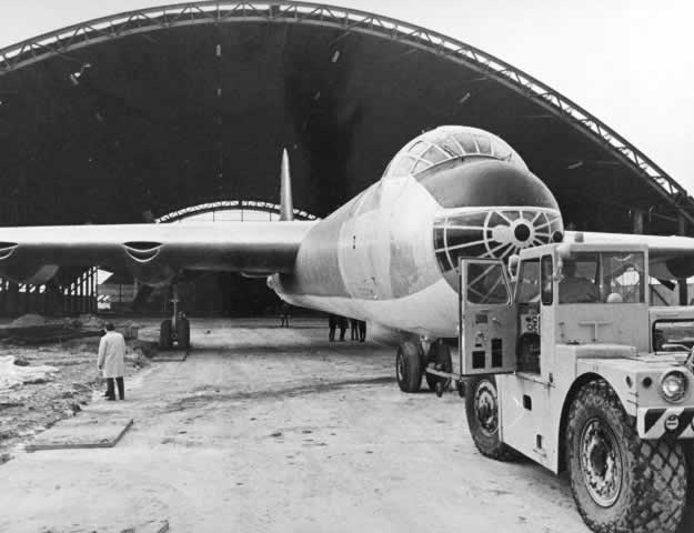 Convair B-36 being transported into the Cold War Wing under construction