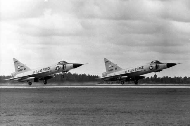 Air Force F-102 Delta Dagger jet fighters in tandem takeoff 