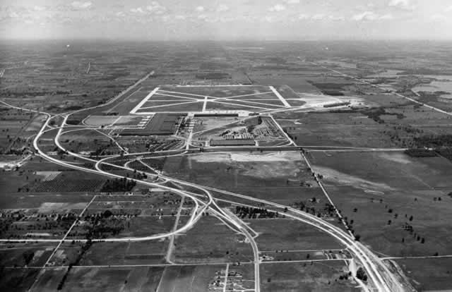 Aerial view of the Willow Run plant, looking east, during WWII ... note the plant, airport and superhighway
