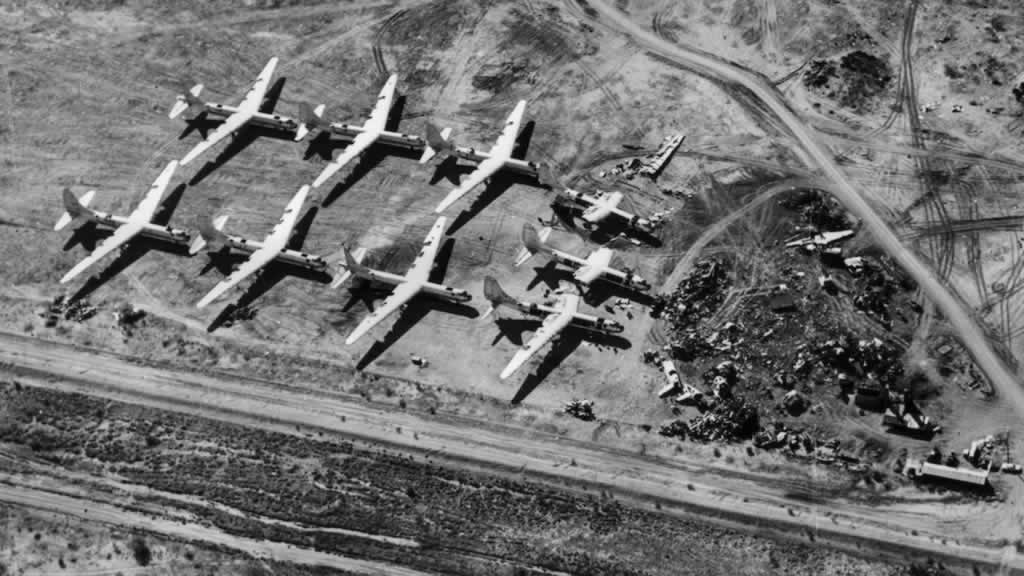 Aerial view of nine B-36 Peacemakers in various stages of being scrapped at Davis-Monthan AFB