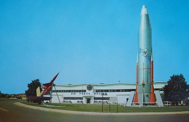 Historic postcard of the United States Air Force in Dayton, Ohio, showing rockets in the foreground