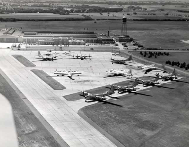 Boeing Wichita Plant, aerial view of completed B-29s parked on tarmac with part of the original Stearman Aircraft plant in the background